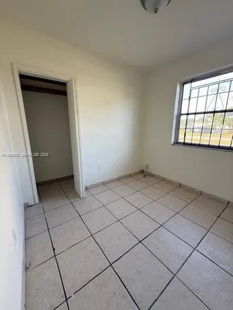 a view of an empty room and window