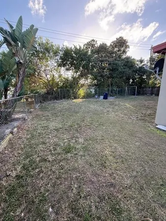 a view of a back yard of the house