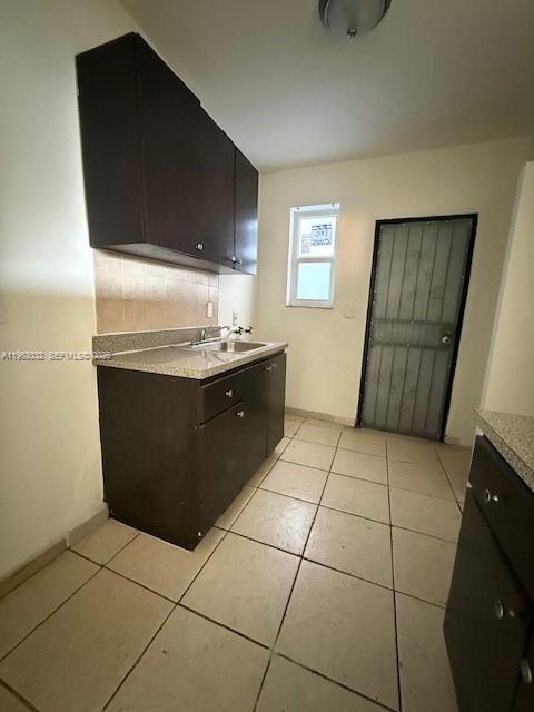 14620 Monroe Street, Unit X Miami, FL 33176 - Photo 7 of 21 a kitchen with a sink a stove and a microwave