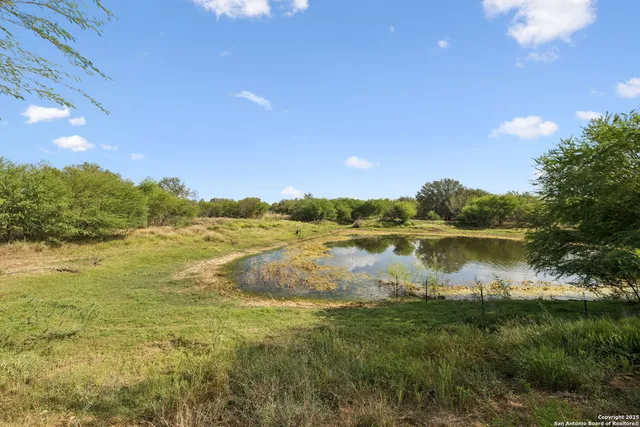 a view of lake with sunset