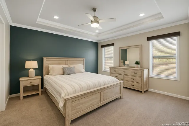 a spacious bedroom with a bed and a closet