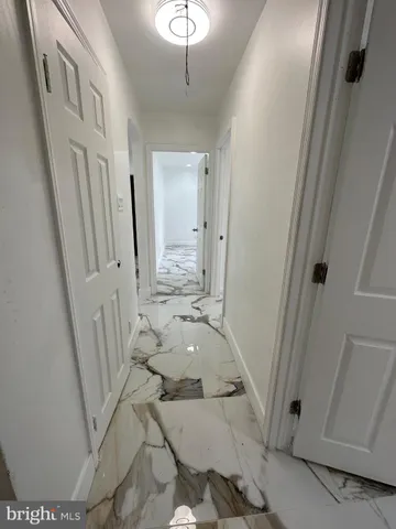 a bathroom with a tub sink and a mirror