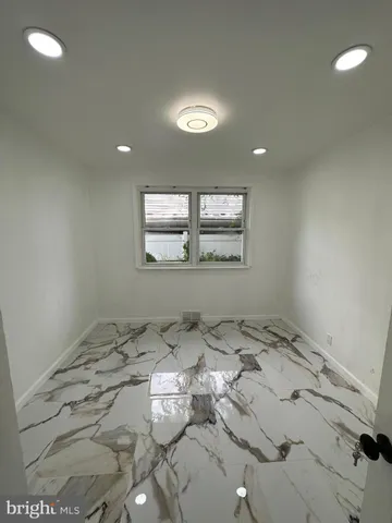 a view of a room with a bed