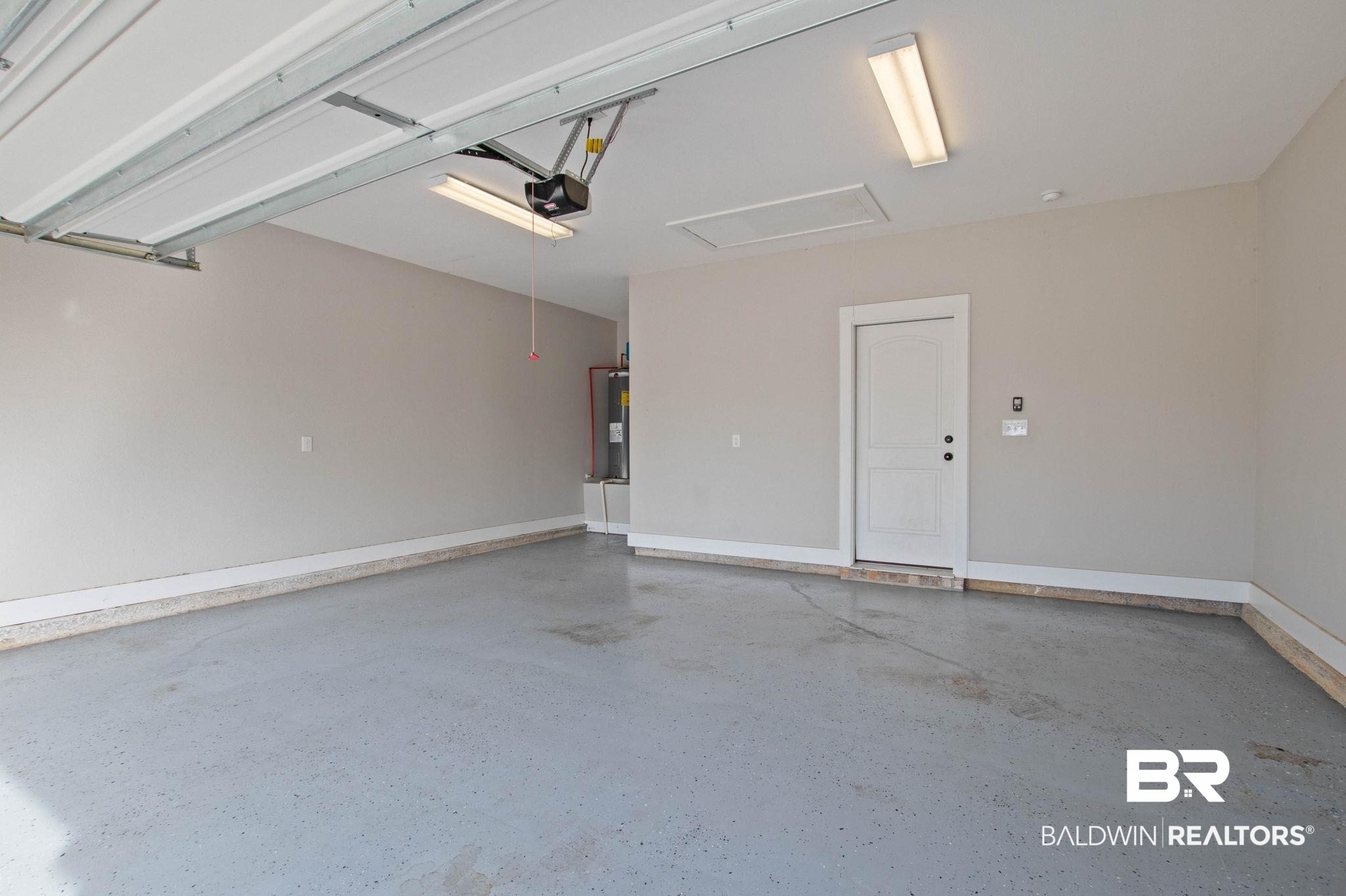 17376 Bankhead Boulevard Fairhope, AL 36532 - Photo 72 of 73 Garage with a garage door opener and electric water heater