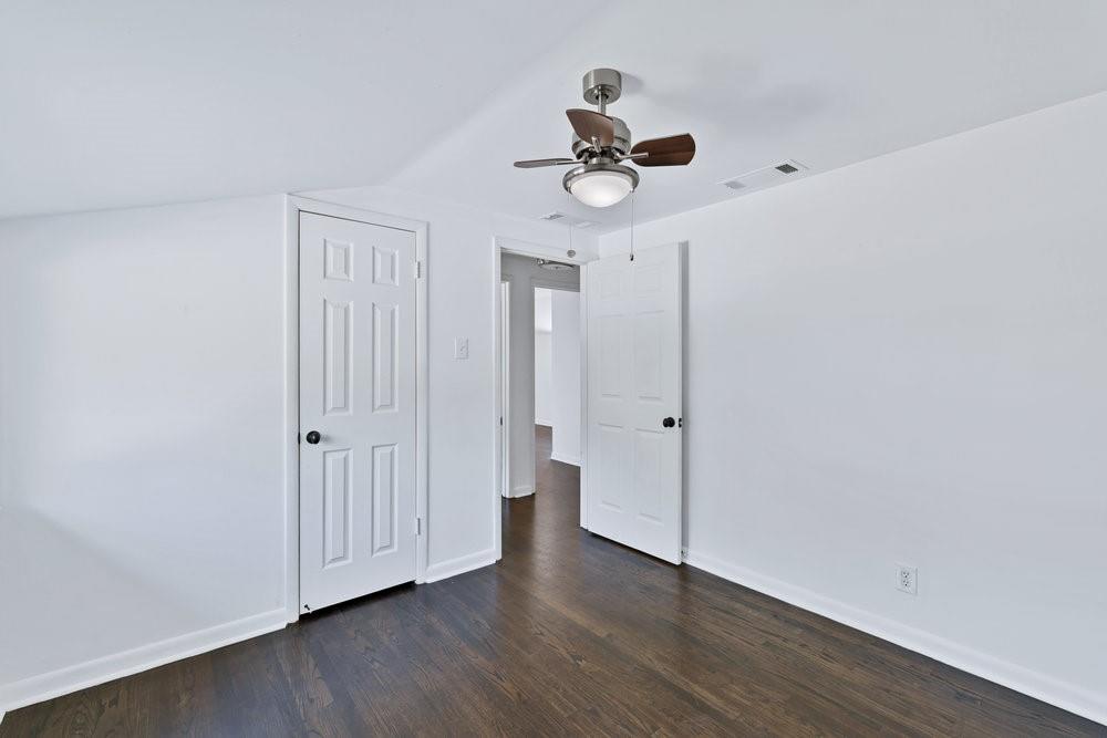 312 West Rio Grande Street Garland, TX 75041 - Photo 11 of 35 a view of an empty room with wooden floor
