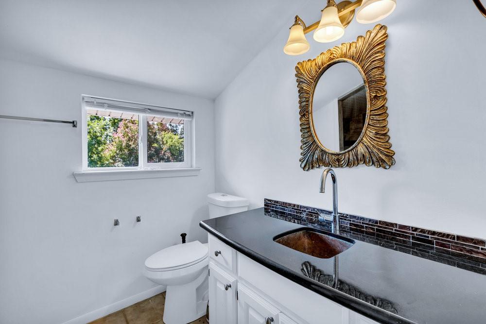 312 West Rio Grande Street Garland, TX 75041 - Photo 18 of 35 a bathroom with a sink and a toilet