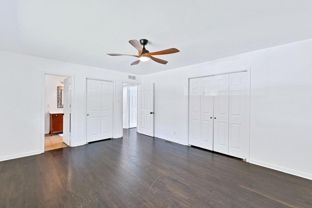 312 West Rio Grande Street Garland, TX 75041 - Photo 19 of 35 a view of a room with wooden floor and ceiling fan