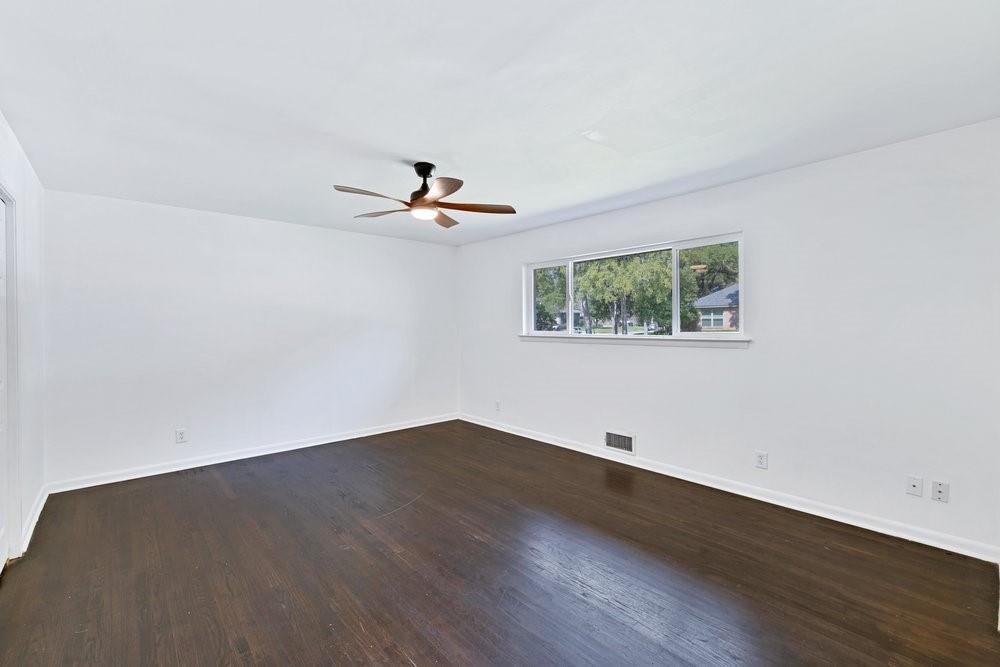 312 West Rio Grande Street Garland, TX 75041 - Photo 20 of 35 wooden floor in an empty room with a window