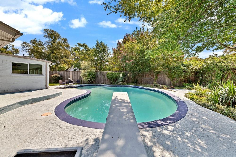 312 West Rio Grande Street Garland, TX 75041 - Photo 21 of 35 a view of a swimming pool with a yard
