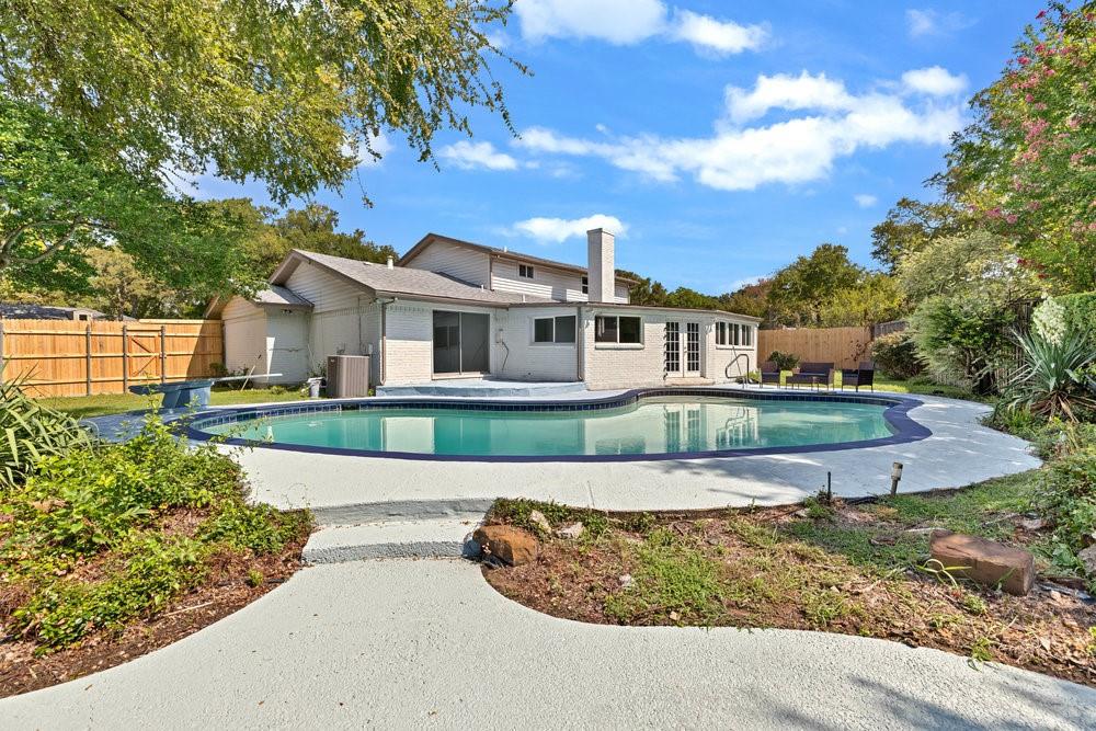 312 West Rio Grande Street Garland, TX 75041 - Photo 25 of 35 a front view of a house with a yard