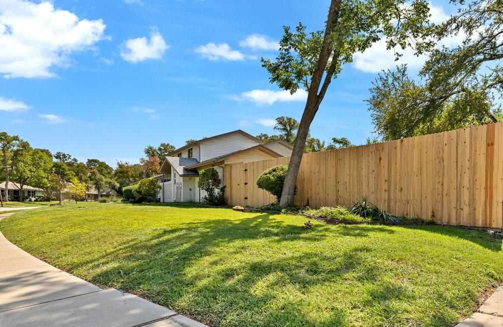 312 West Rio Grande Street Garland, TX 75041 - Photo 29 of 35 a front view of house with yard and trees