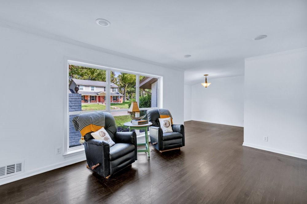 312 West Rio Grande Street Garland, TX 75041 - Photo 3 of 35 a living room with furniture and a wooden floor