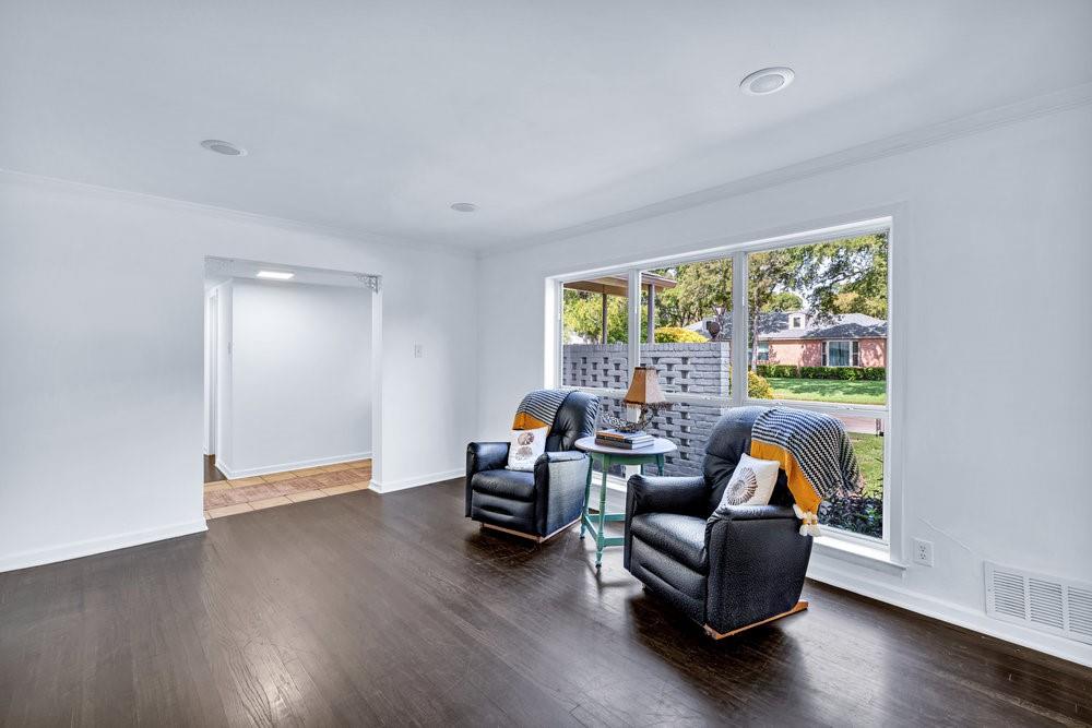 312 West Rio Grande Street Garland, TX 75041 - Photo 4 of 35 a living room with furniture and a large window