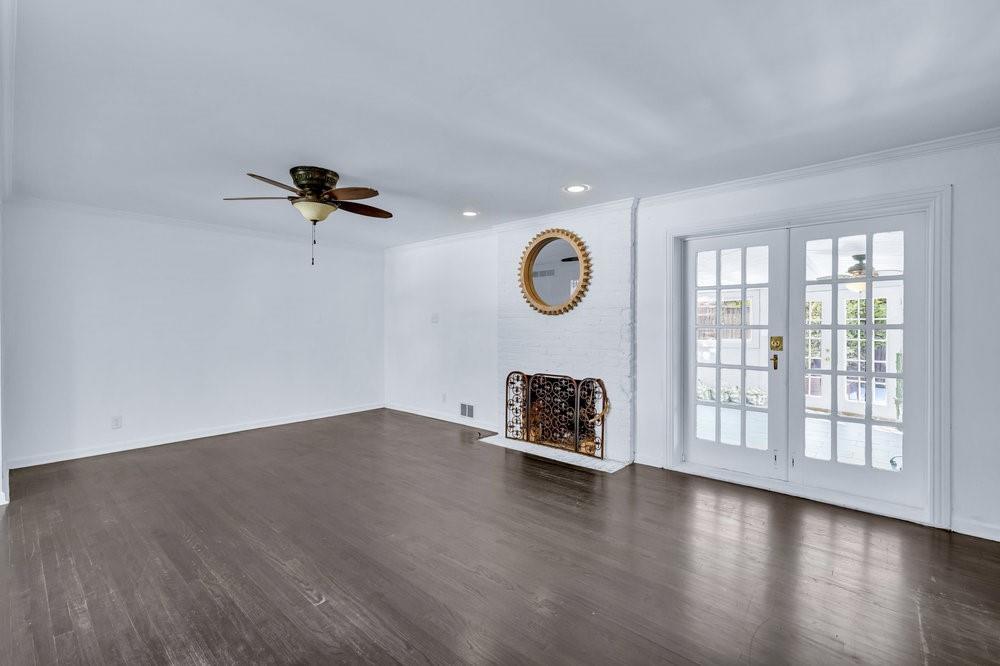 312 West Rio Grande Street Garland, TX 75041 - Photo 7 of 35 a view of a livingroom with wooden floor and a window