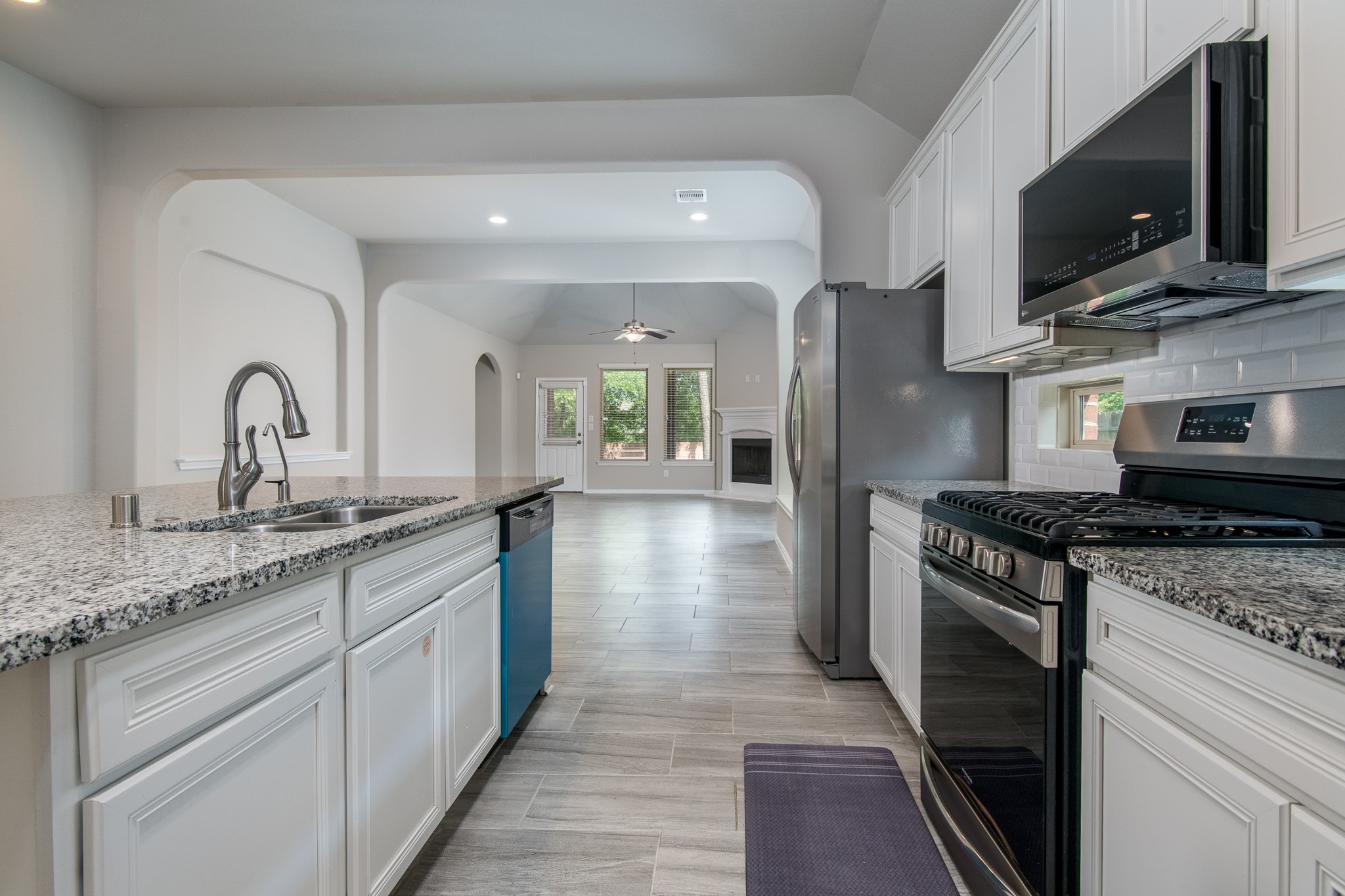 3211 Discovery Lane Conroe, TX 77301 - Photo 10 of 22 Lovely kitchen with tons of cabinets, stainless steel appliances and granite counter tops