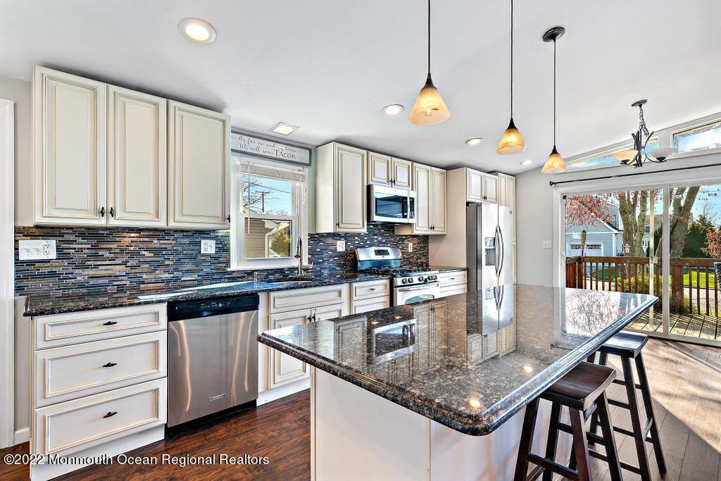 36 Cabana Drive Brick, NJ 08723 - Photo 18 of 42 a kitchen with stainless steel appliances granite countertop a sink a stove and a refrigerator