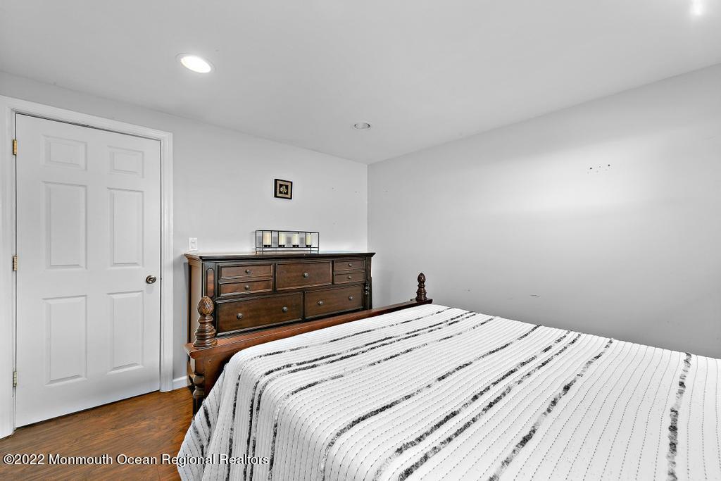 36 Cabana Drive Brick, NJ 08723 - Photo 26 of 42 a bedroom with a bed and a night stand