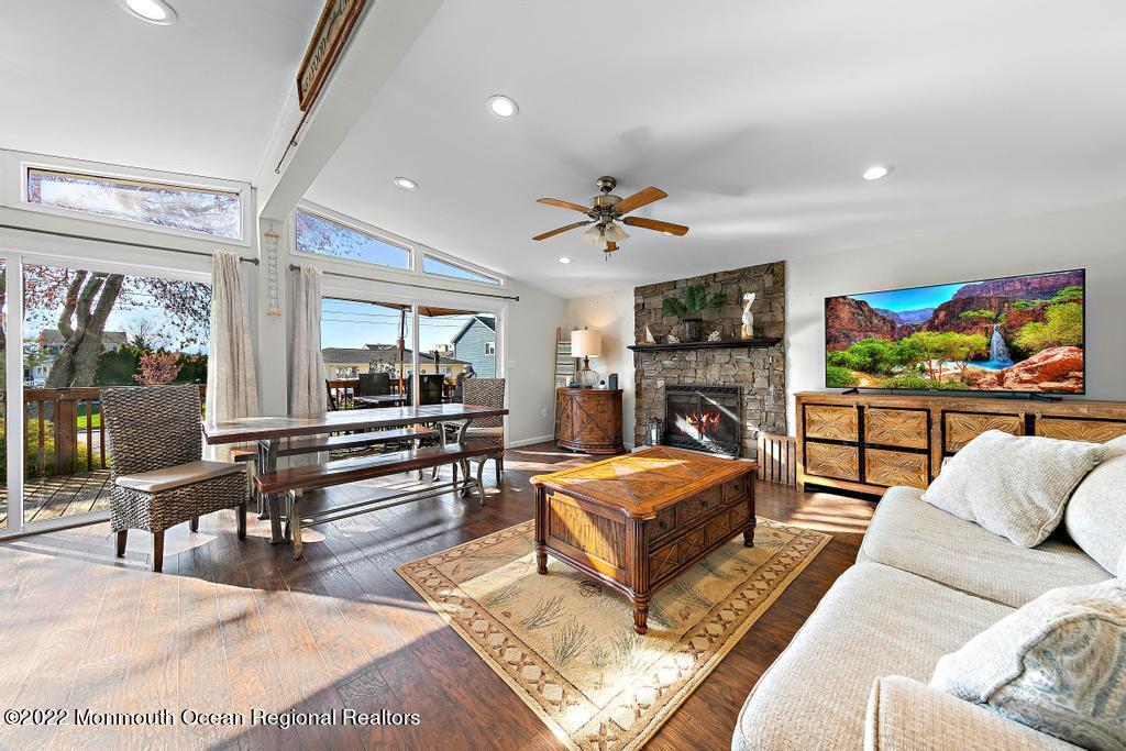 36 Cabana Drive Brick, NJ 08723 - Photo 4 of 42 a living room with furniture a fireplace and a flat screen tv