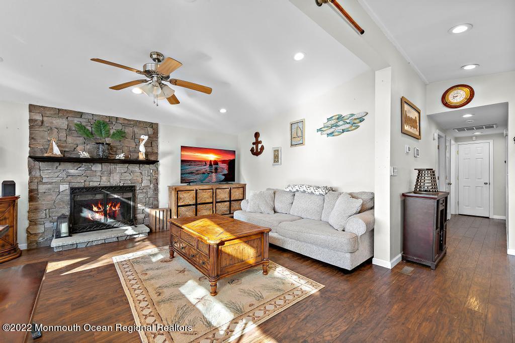 36 Cabana Drive Brick, NJ 08723 - Photo 7 of 42 a living room with furniture a fireplace and a flat screen tv
