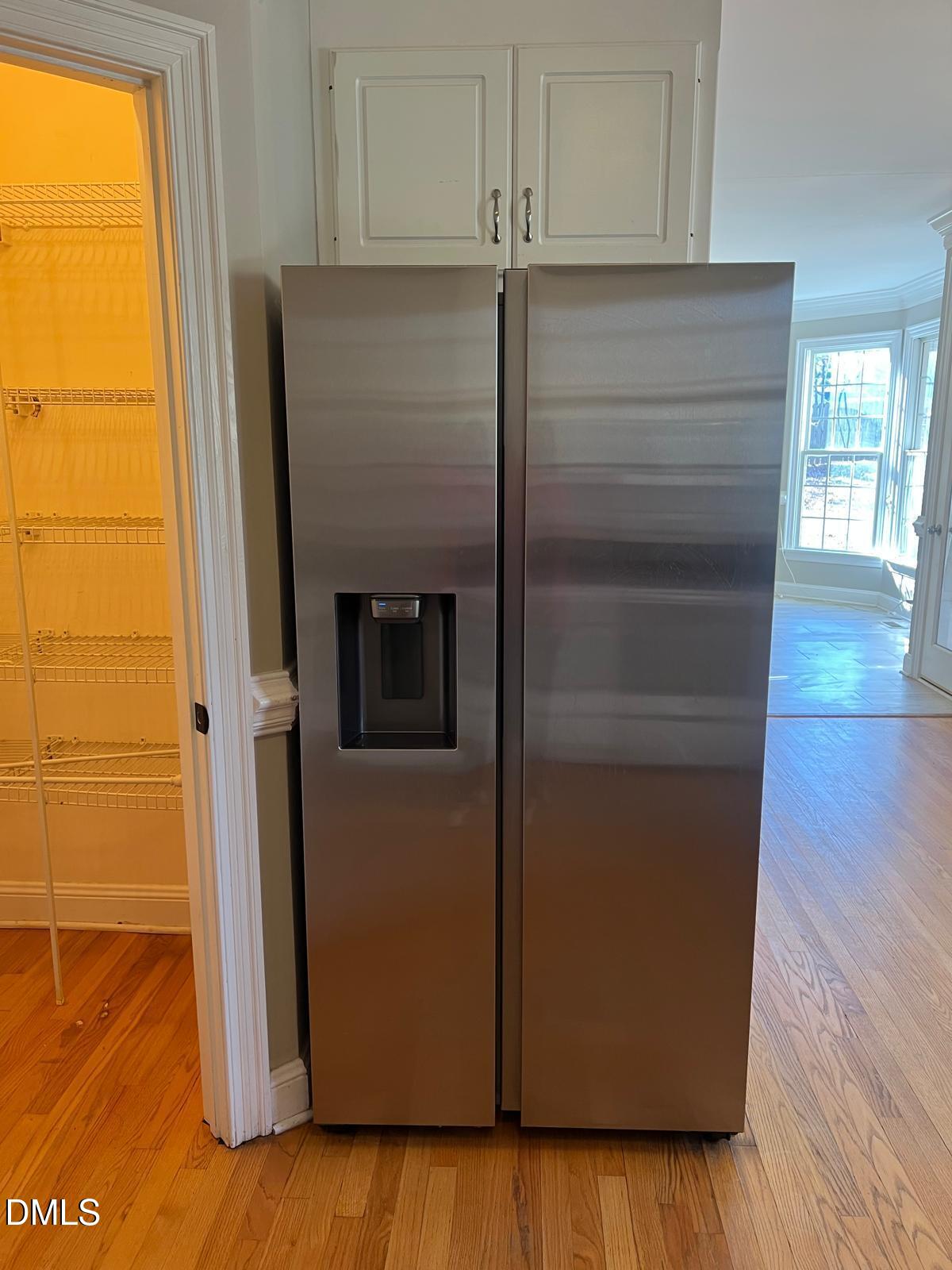 402 Cricket Hearth Road Sanford, NC 27330 - Photo 16 of 67 a view of storage and utility room with wooden floor