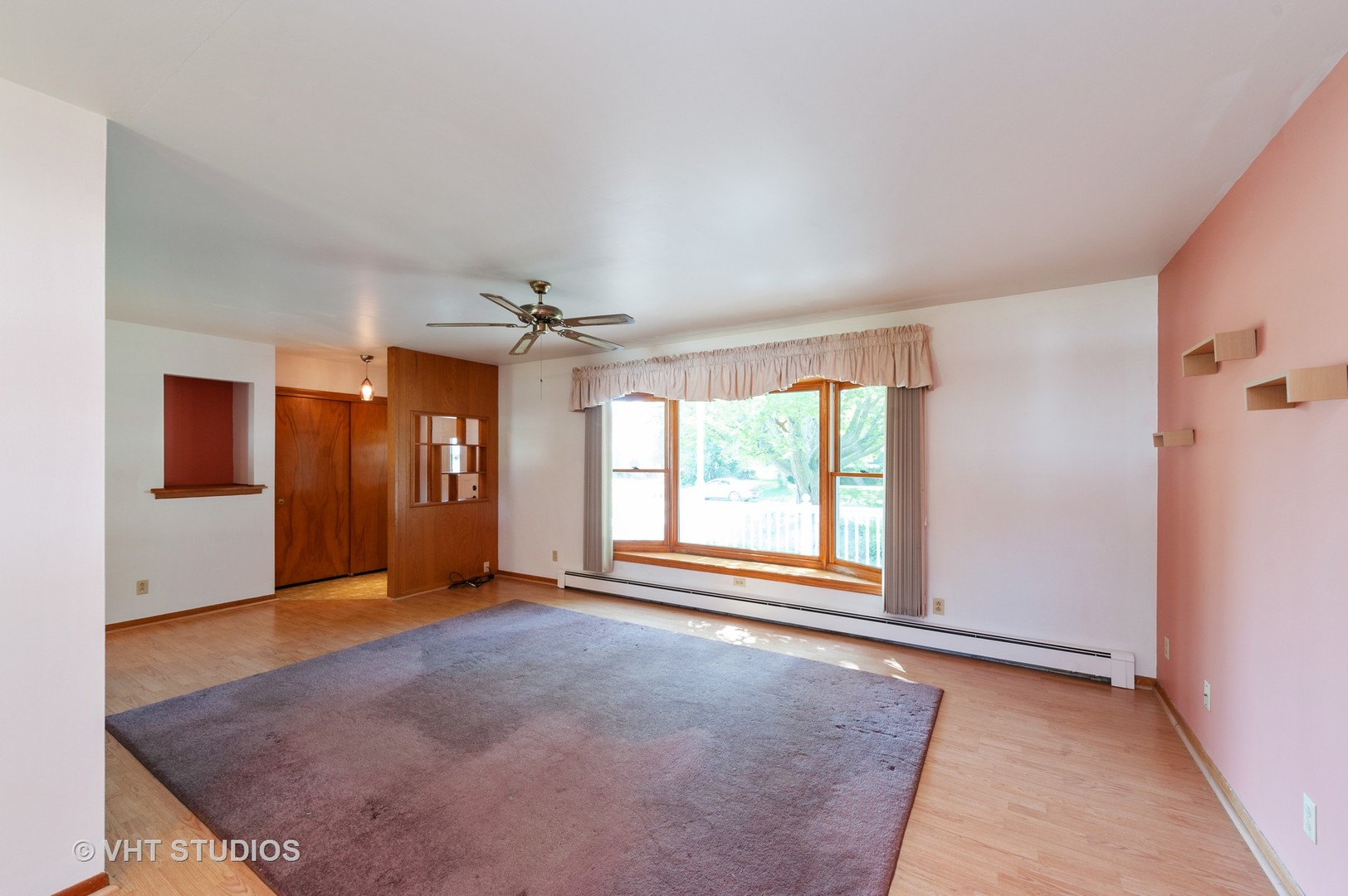 9620 Jean Drive Hebron, IL 60034 - Photo 3 of 11 an empty room with windows and chandelier fan