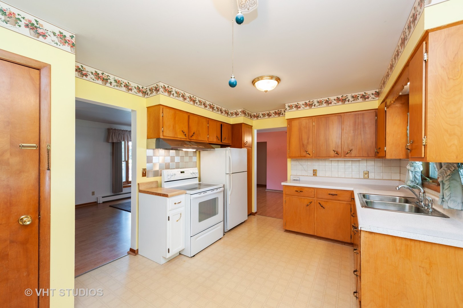 9620 Jean Drive Hebron, IL 60034 - Photo 6 of 11 a kitchen with a stove a sink and a refrigerator
