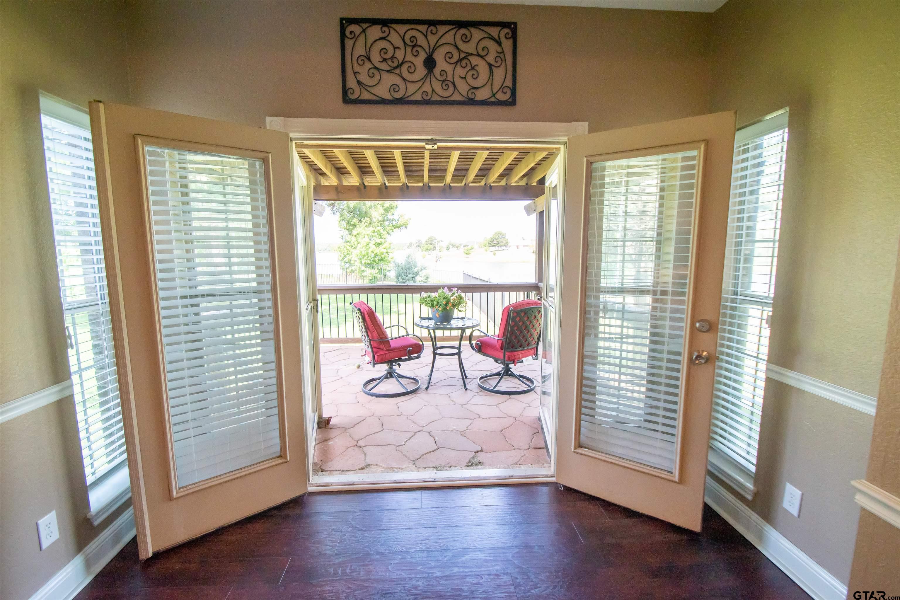 23120 Saddle Ridge Court Lindale, TX 75771 - Photo 12 of 37 a view of a livingroom with wooden floor and a window