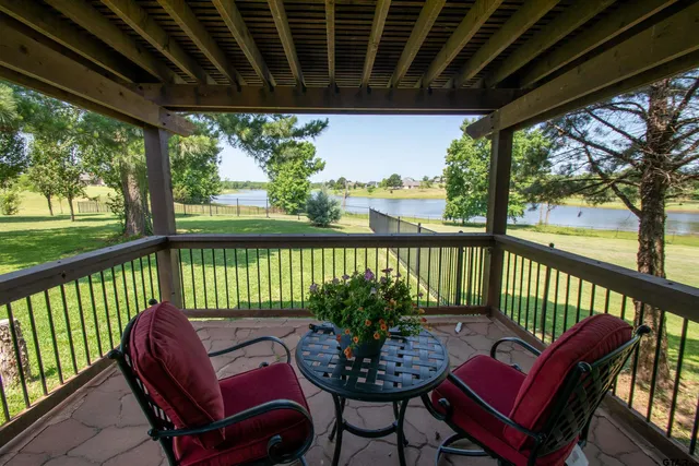a view of a chair and table in the balcony
