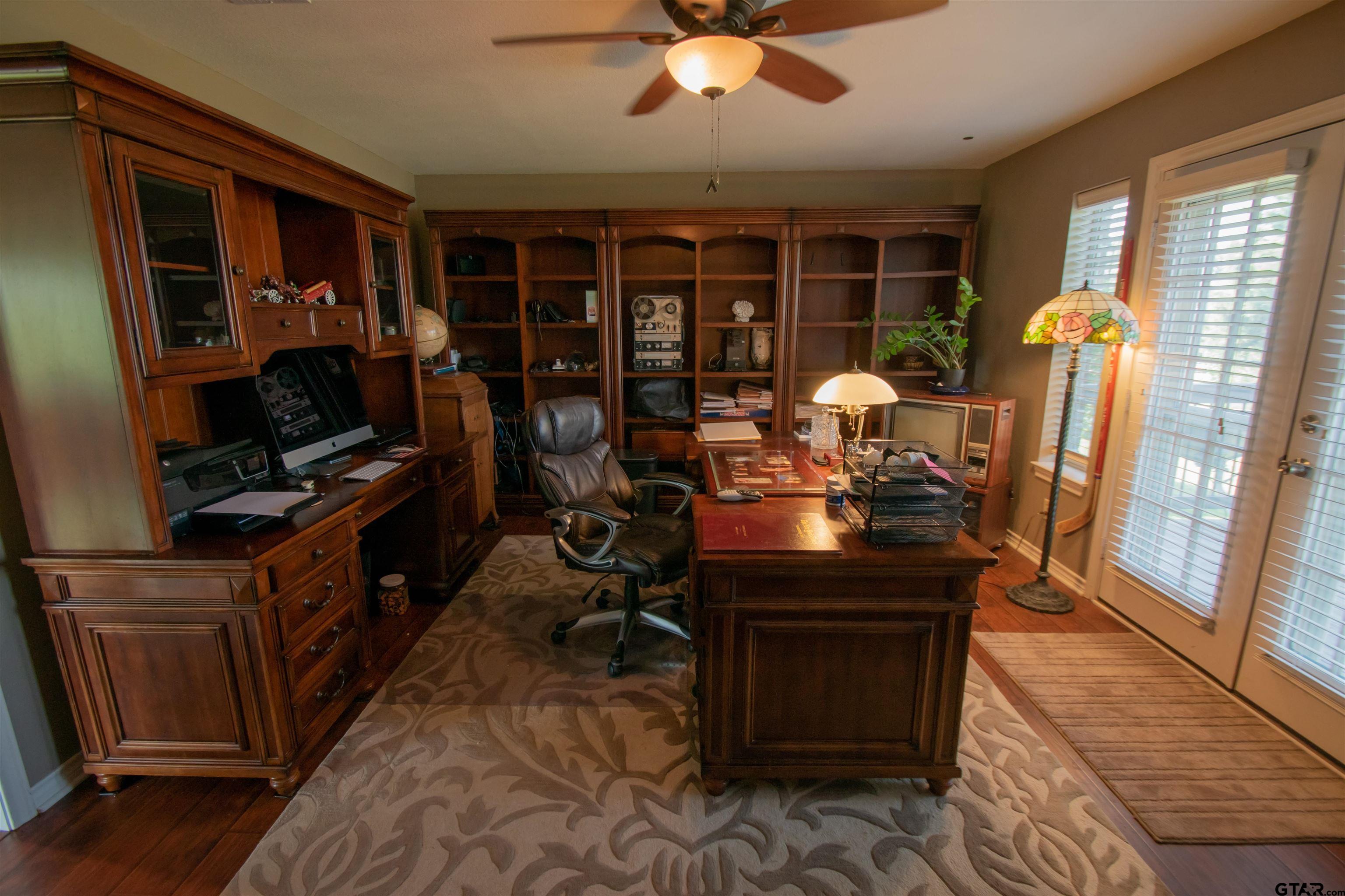 23120 Saddle Ridge Court Lindale, TX 75771 - Photo 18 of 37 a view of a workspace with furniture and a window
