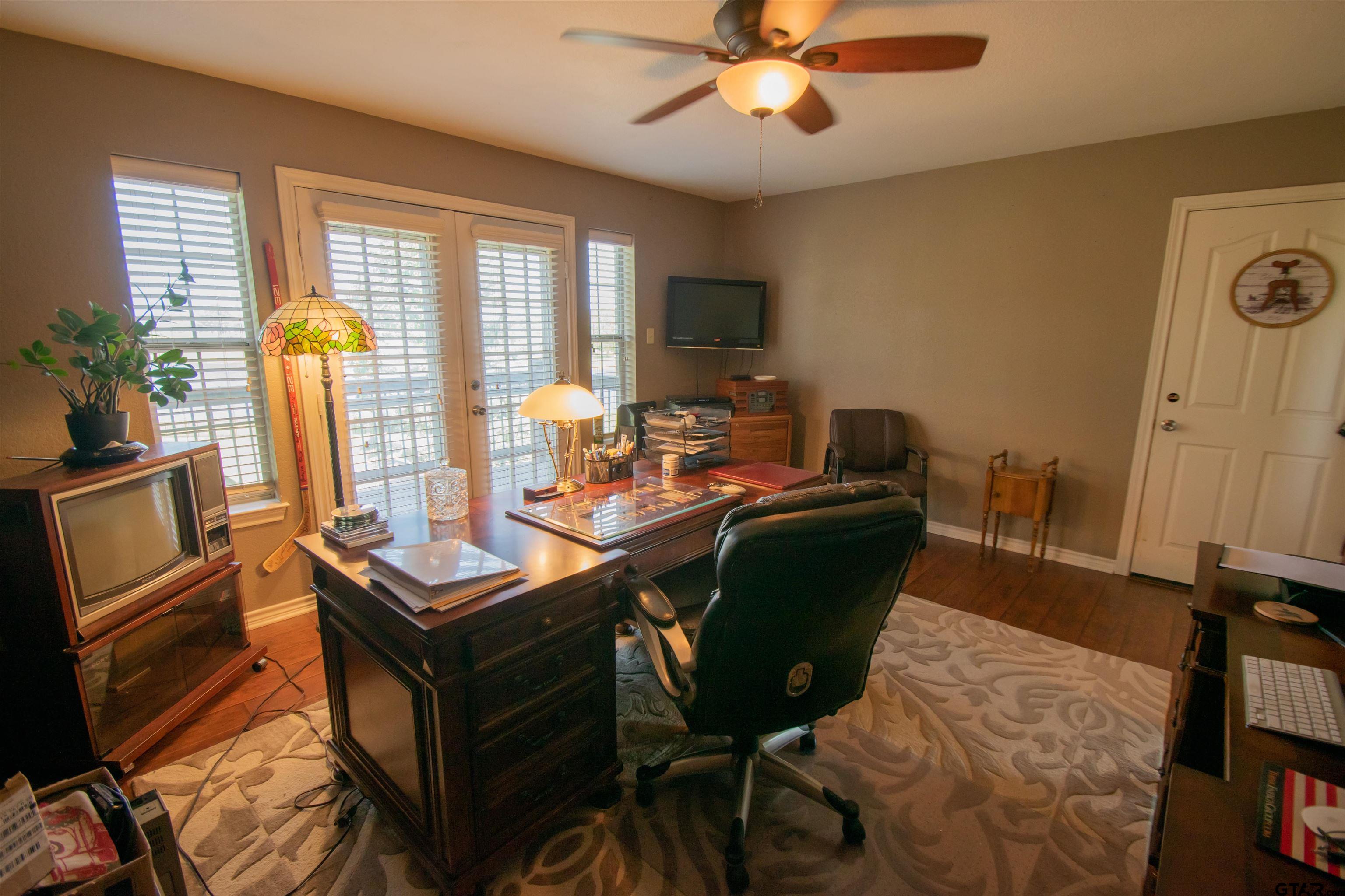 23120 Saddle Ridge Court Lindale, TX 75771 - Photo 19 of 37 a living room with furniture and a window