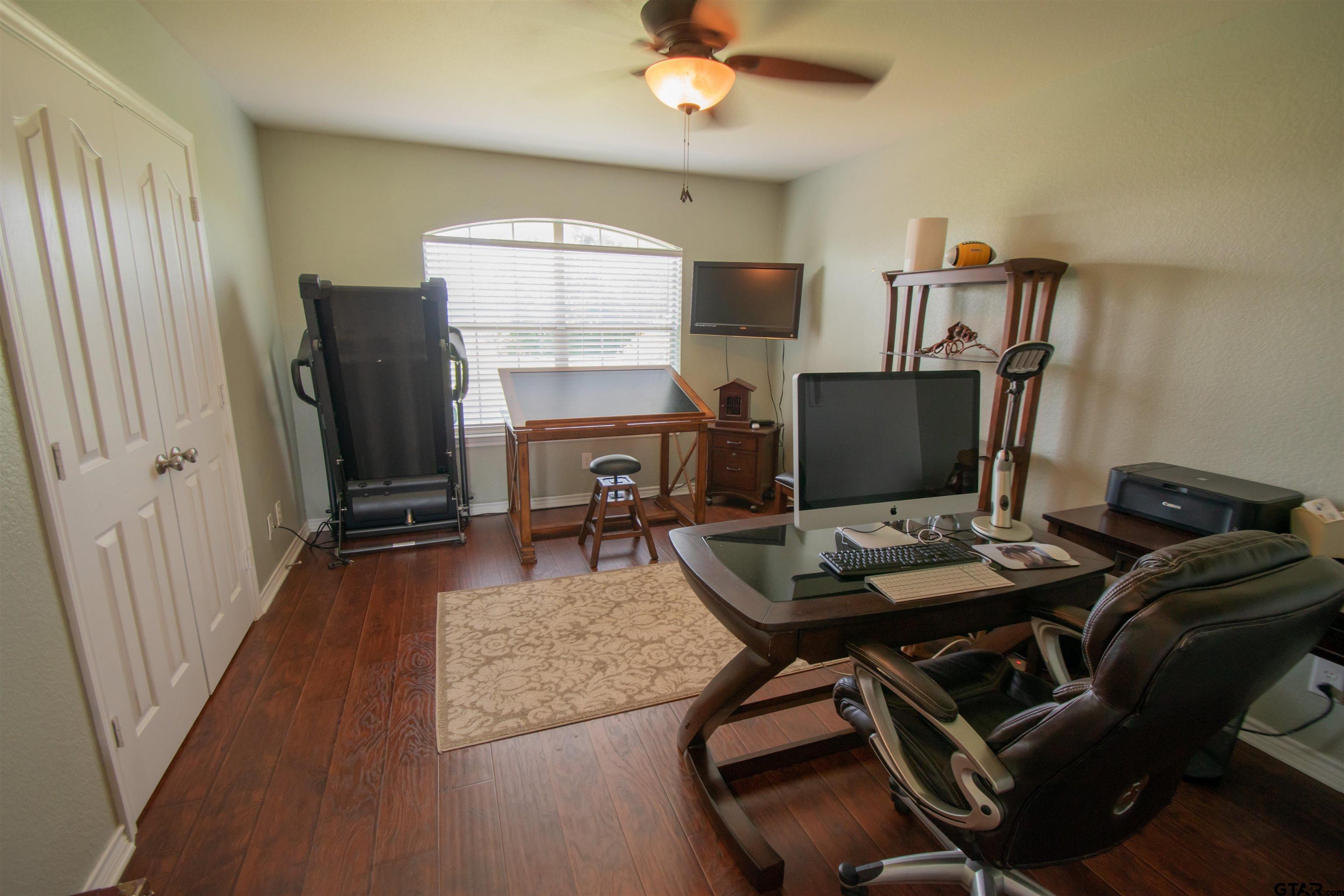 23120 Saddle Ridge Court Lindale, TX 75771 - Photo 20 of 37 a workspace with furniture and a flat screen tv