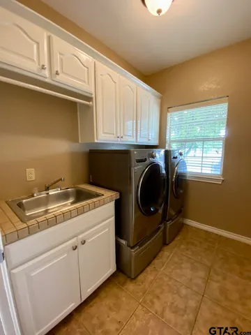 a view of a kitchen with washer and dryer