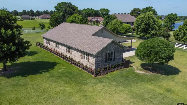 an aerial view of a house having yard