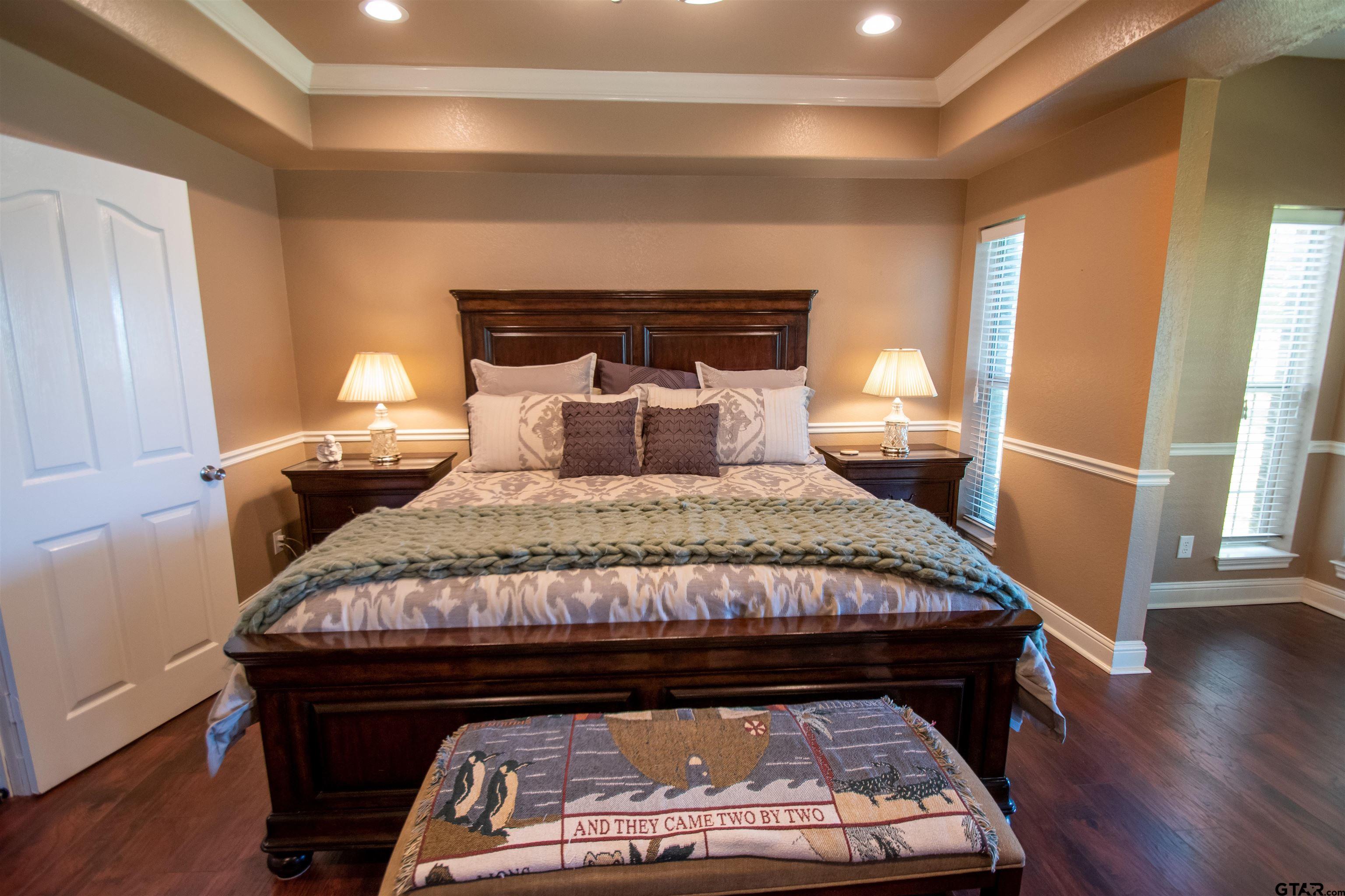 23120 Saddle Ridge Court Lindale, TX 75771 - Photo 10 of 37 a bedroom with a bed and wooden floor