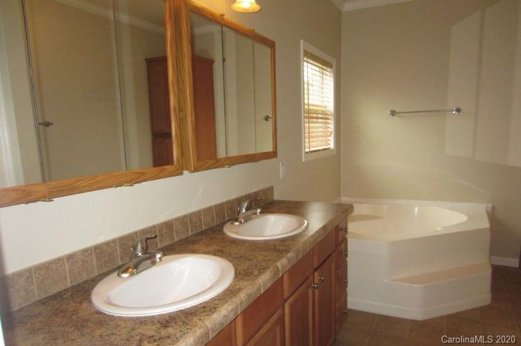 6716 Love Point Road Denver, NC 28037 - Photo 12 of 19 a bathroom with a granite countertop sink and a mirror