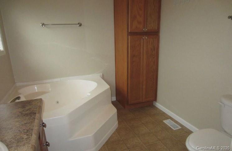 6716 Love Point Road Denver, NC 28037 - Photo 13 of 19 a bathroom with a sink and toilet