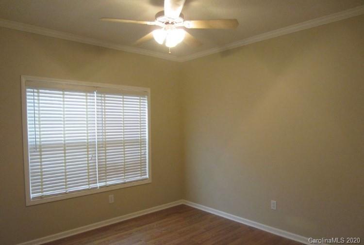 6716 Love Point Road Denver, NC 28037 - Photo 17 of 19 an empty room with a window and a fan