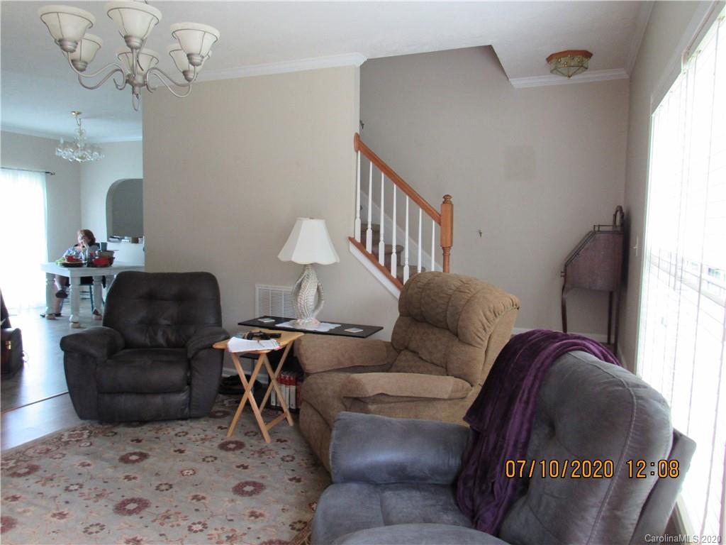 6716 Love Point Road Denver, NC 28037 - Photo 5 of 19 a living room with furniture flowerpot and a chandelier