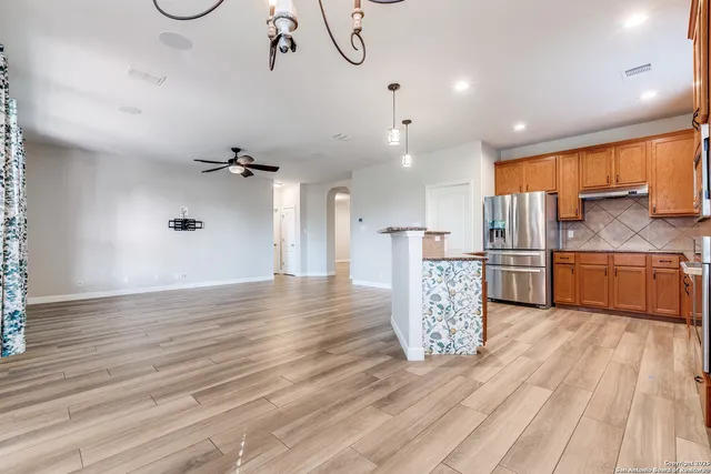 a kitchen with stainless steel appliances a stove sink and microwave