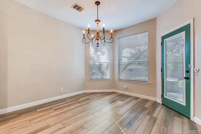 a view of a kitchen with a sink and a large window