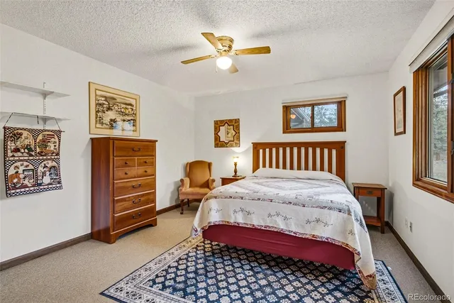 a bedroom with a bed and a table in it