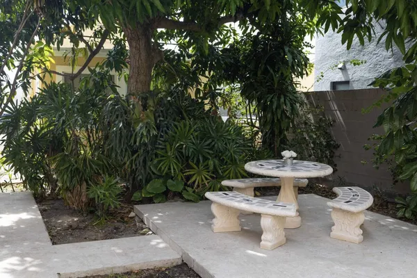 a view of a backyard with sitting area
