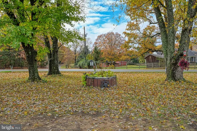 a view of house with outdoor space and porch