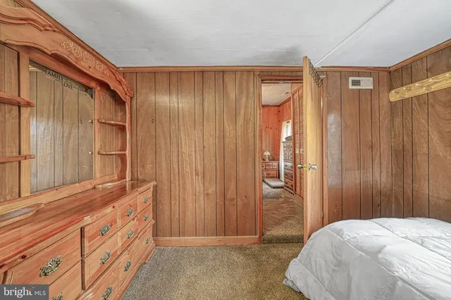 a bedroom with a bed and a closet