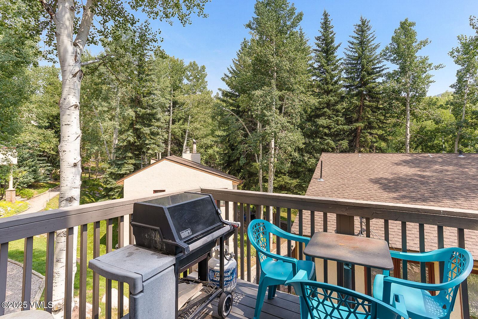 1490 Buffehr Creek Road, Unit A44 Vail, CO 81657 - Photo 12 of 39 a view of a two chairs and table in the balcony