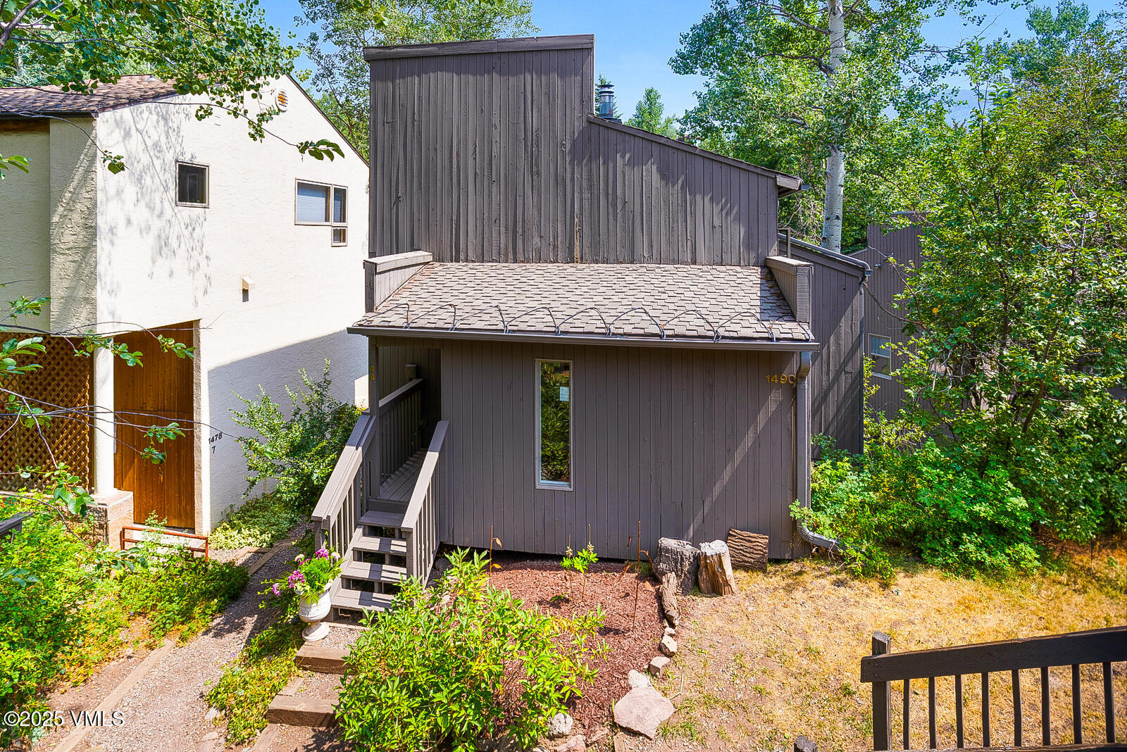 1490 Buffehr Creek Road, Unit A44 Vail, CO 81657 - Photo 26 of 39 a view of a house with wooden fence