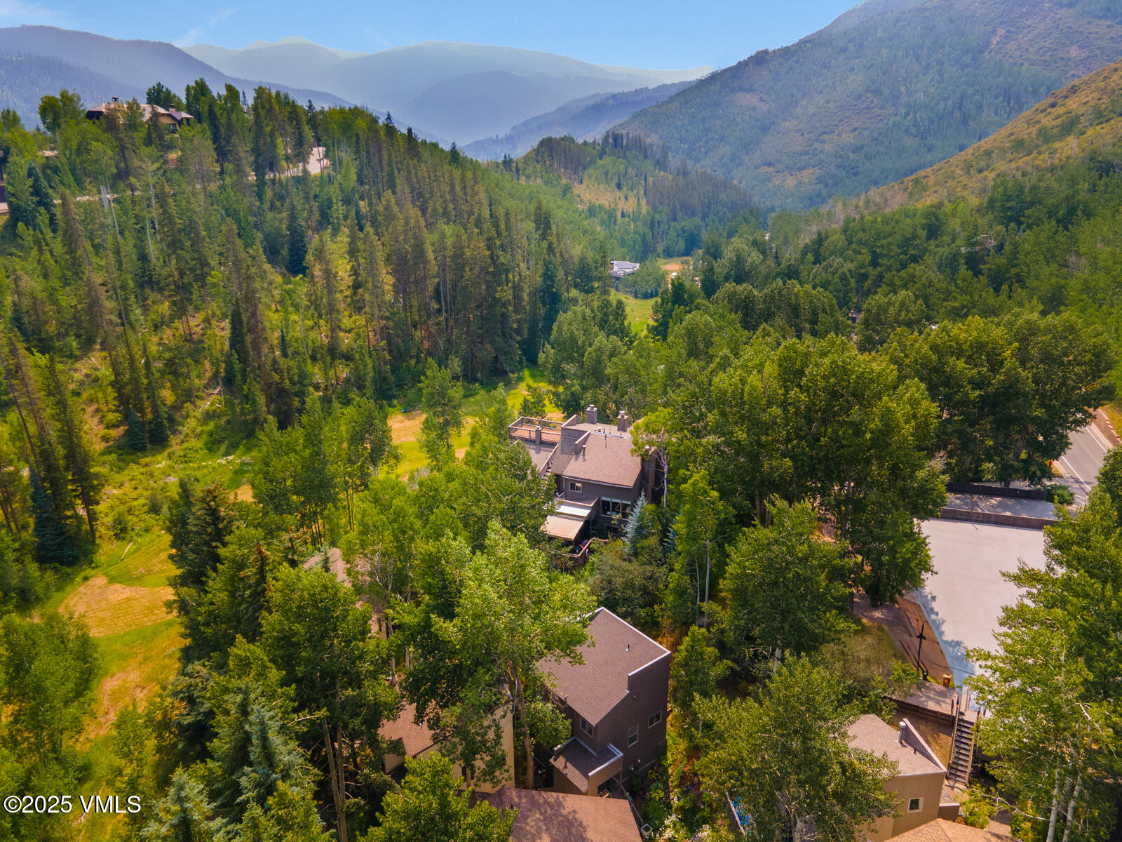 1490 Buffehr Creek Road, Unit A44 Vail, CO 81657 - Photo 32 of 39 a view of a city with lush green forest