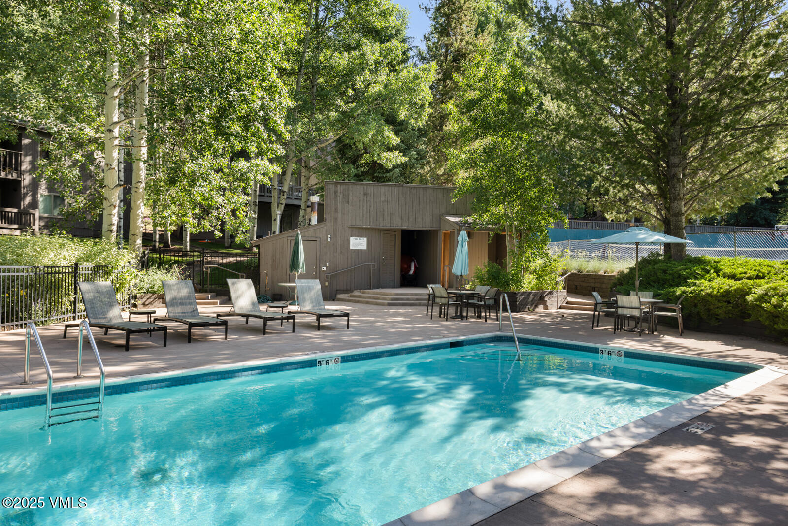 1490 Buffehr Creek Road, Unit A44 Vail, CO 81657 - Photo 36 of 39 a view of backyard of house with outdoor seating and green space