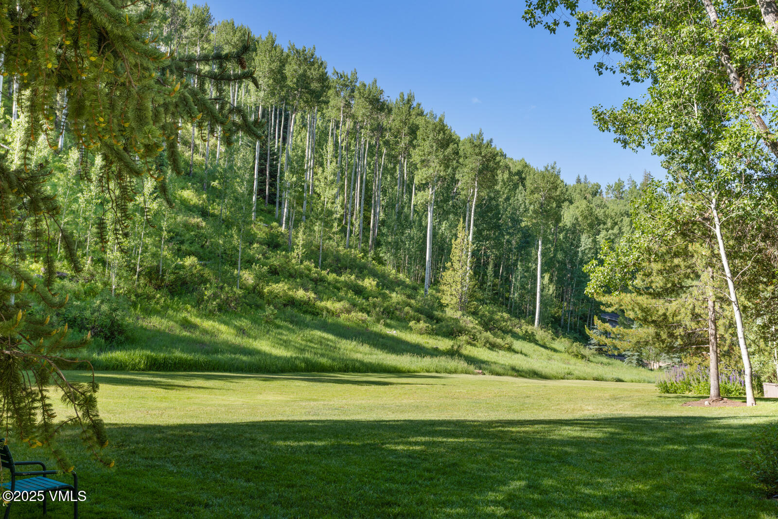 1490 Buffehr Creek Road, Unit A44 Vail, CO 81657 - Photo 38 of 39 a view of a golf course with a lake