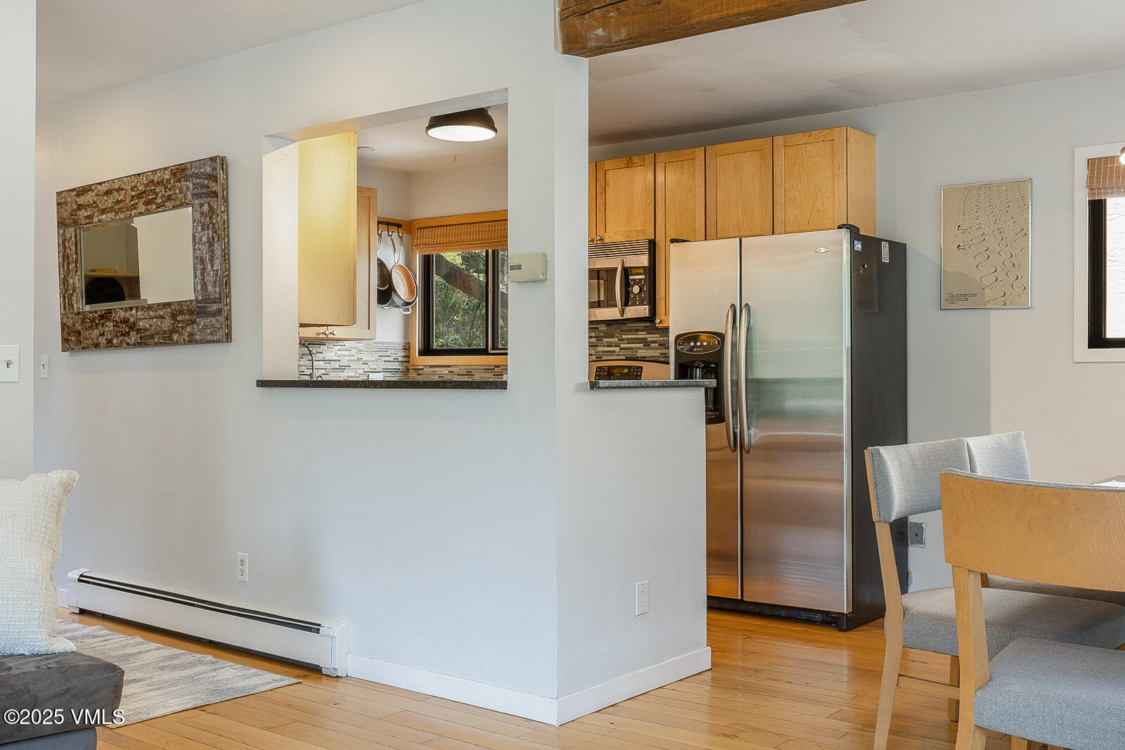 1490 Buffehr Creek Road, Unit A44 Vail, CO 81657 - Photo 8 of 39 a kitchen with stainless steel appliances a refrigerator and wooden floor